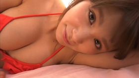 Ikumi Hisamatsu lounging on a bed in a red bikini Red swimsuit042